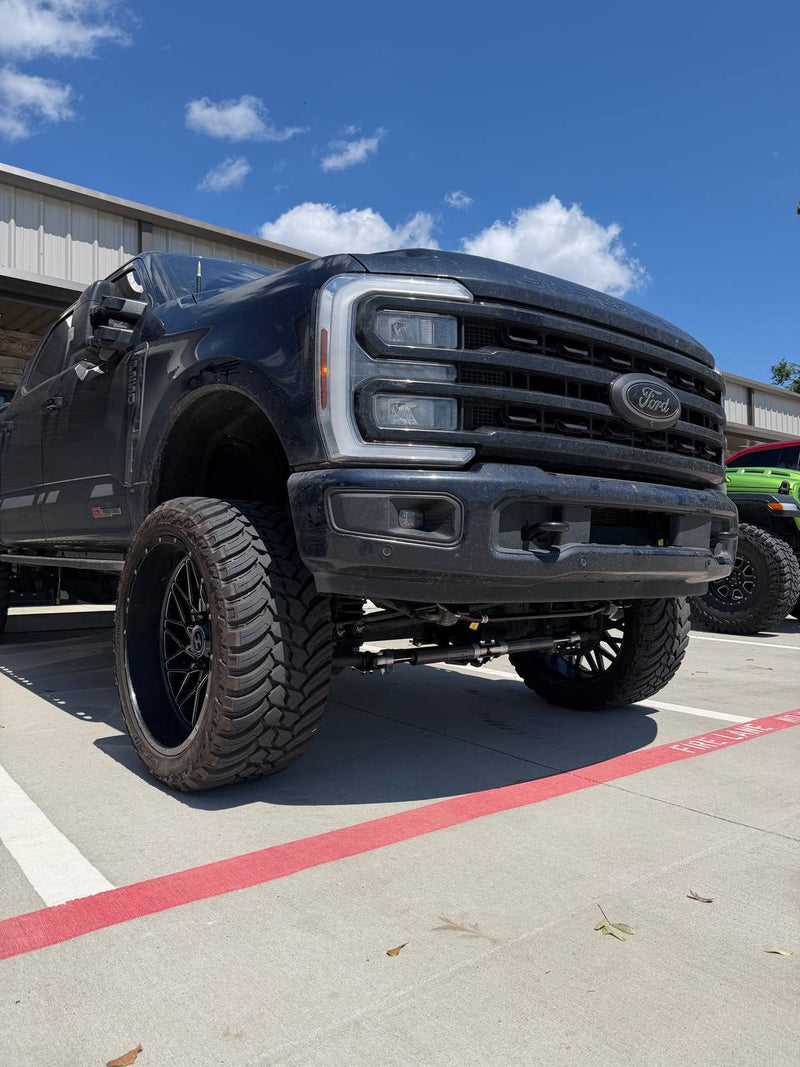 Ford F-250 with a 6-inch ReadyLIFT lift kit, custom wheels and tires — built by Lift Pro Customs in Willis, TX