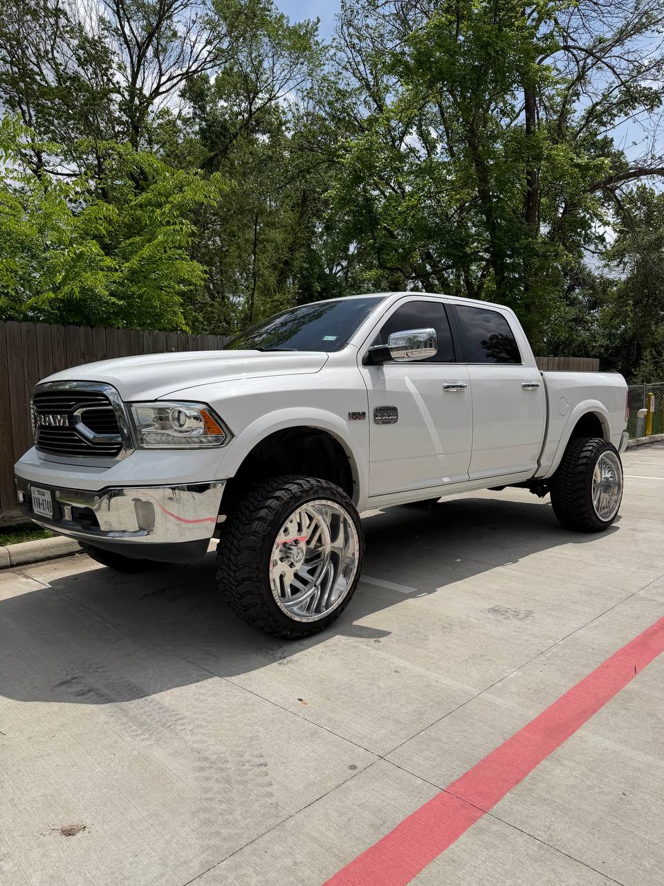 Ram 1500 Lift + Wheels + Tires — photo 1 of 3 — installed by Lift Pro Customs, Willis TX
